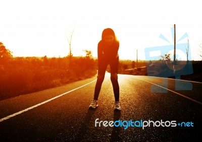 Woman Exercising Outdoor At Sunset  Stock Photo