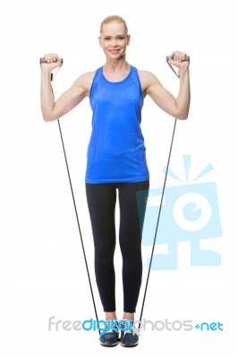 Woman Exercising With Rubber Band Stock Photo