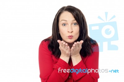 Woman Giving An Air Kiss Stock Photo