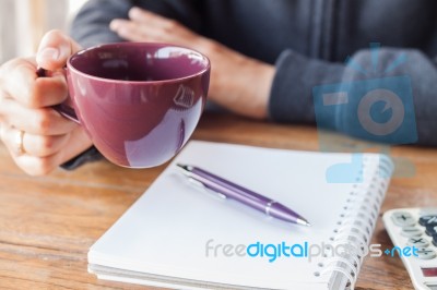 Woman Hand Holding A Cup Of Coffee Stock Photo