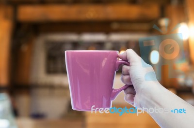 Woman Hand Holding Coffee Cup In Coffee Shop Stock Photo