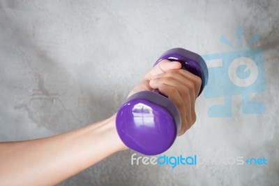 Woman Hand Holding Violet Dumbbell Stock Photo