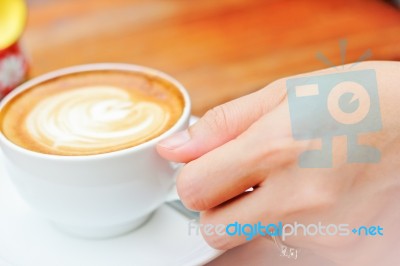 Woman Hand With A White Cup Coffee Stock Photo