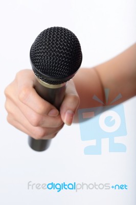 Woman Hand With Microphone Stock Photo