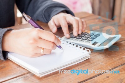 Woman Hand With Pen Writing On Notebook Stock Photo