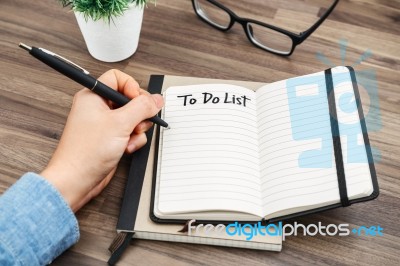 Woman Hand Writing To Do List Stock Photo