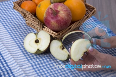 Woman Hands Peeling An Apple With A Knife Stock Photo