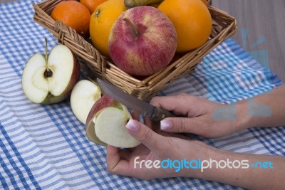 Woman Hands Peeling An Apple With A Knife Stock Photo