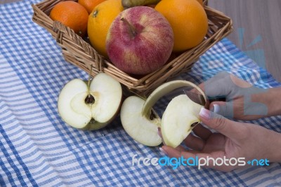 Woman Hands Peeling An Apple With A Knife Stock Photo