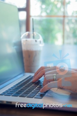 Woman Hands Typing On Laptop Stock Photo