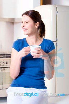 Woman Having A Cup Of Tea Stock Photo