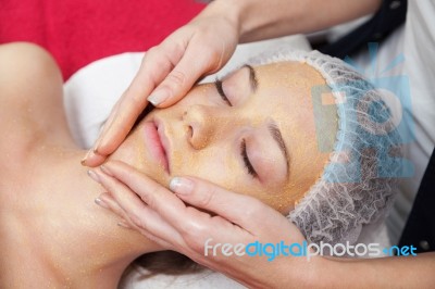 Woman Having Facial Mask At Beauty Salon Stock Photo