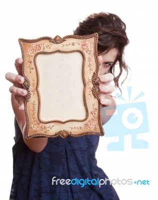 Woman Hiding Face With An Picture Frame Stock Photo