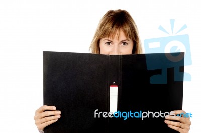 Woman Hiding Face With Business File Stock Photo