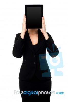 Woman Hiding Her Face With Tablet Pc Stock Photo