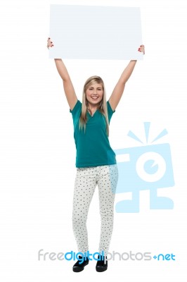 Woman Holding Ad Board Above Her Head Stock Photo