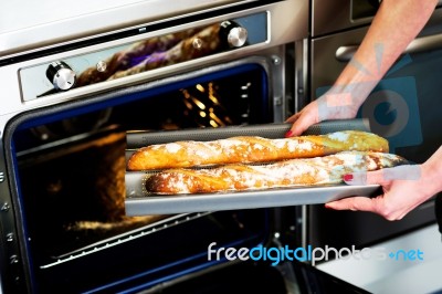 Woman Holding Baguette Stock Photo