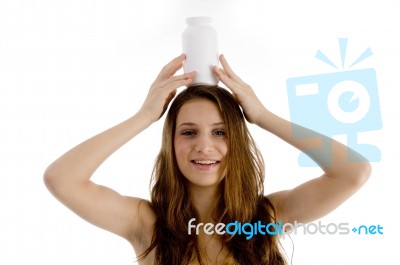 Woman Holding Bottle On Her Head Stock Photo