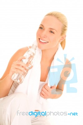 Woman Holding Bottle With Towel Stock Photo