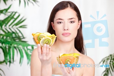 Woman Holding Bowls Full Of Fruit Stock Photo