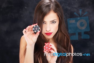 Woman Holding Chips For Gambling Stock Photo