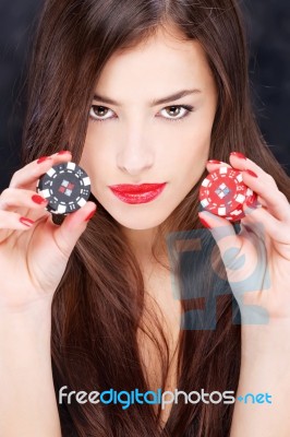 Woman Holding Chips For Gambling Stock Photo