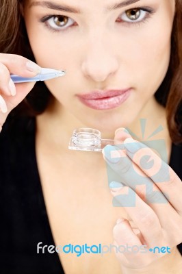 Woman Holding Contact Lens Stock Photo