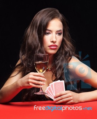Woman Holding Gambling Cards And Wine Stock Photo