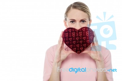 Woman Holding Gift Box In Form Of Heart Stock Photo