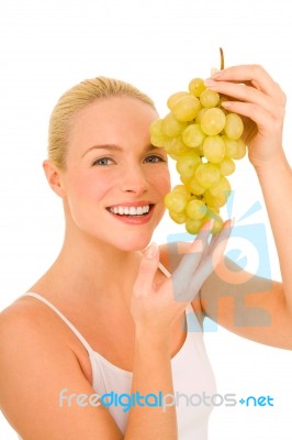 Woman Holding Grapes Stock Photo