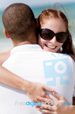 Woman Holding Her Husband Stock Photo