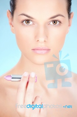 Woman Holding Lipstick Stock Photo