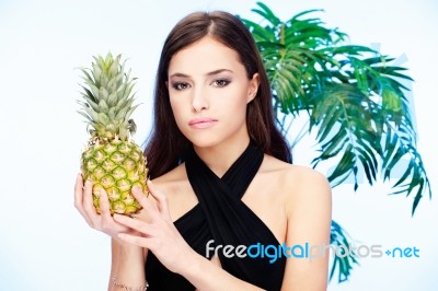 Woman Holding Pineapple Stock Photo