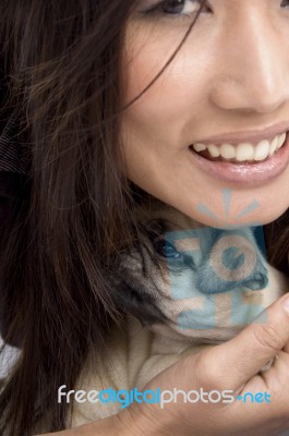 Woman Holding Puppy Stock Photo