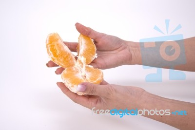 Woman Holding Slices Of Orange Stock Photo