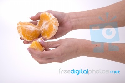 Woman Holding Slices Of Orange Stock Photo