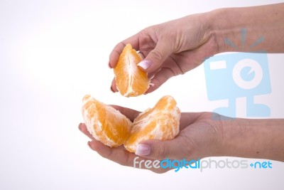 Woman Holding Slices Of Orange Stock Photo