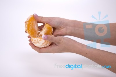 Woman Holding Slices Of Orange Stock Photo