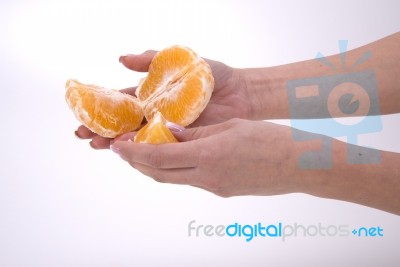 Woman Holding Slices Of Orange Stock Photo