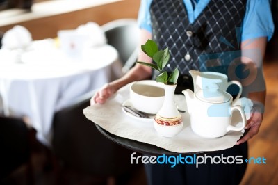 Woman Holding Tea Tray Stock Photo