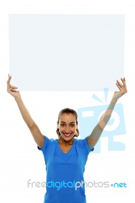 Woman Holding Up Blank White Ad Board Stock Photo