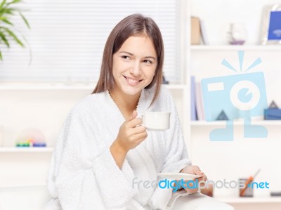 Woman In Bathrobe Relaxing At Home Stock Photo