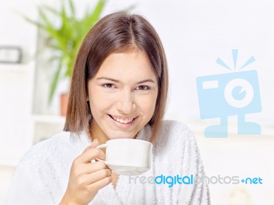 Woman In Bathrobe Relaxing At Home Stock Photo