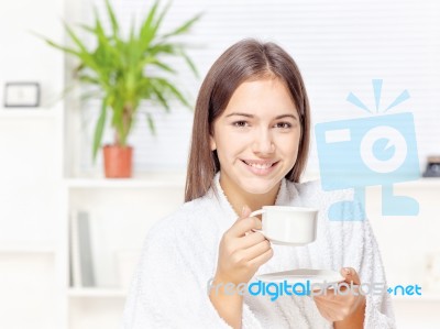 Woman In Bathrobe Relaxing At Home Stock Photo