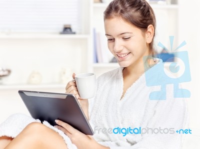 Woman In Bathrobe Relaxing At Home Stock Photo