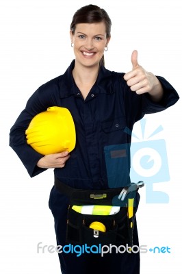 Woman In Builder Uniform Showing Thumbs Up Stock Photo