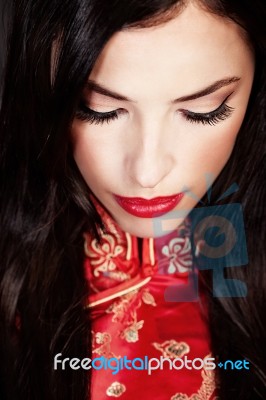 Woman In Red Cheongsam Stock Photo