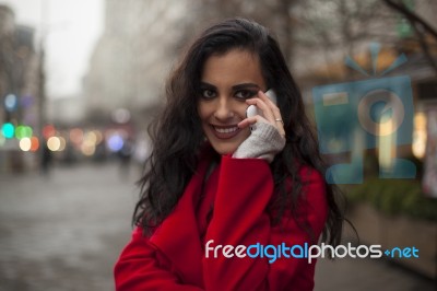 Woman In Red Coat With Mobile Phone In Hands, Smartphone, Urban Stock Photo