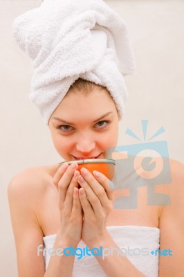 Woman In Spa Holding Bowl Near Mouth Stock Photo