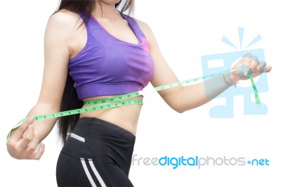 Woman In Sport Bra Measuring Her Body With Tape Isolated On Whit… Stock Photo